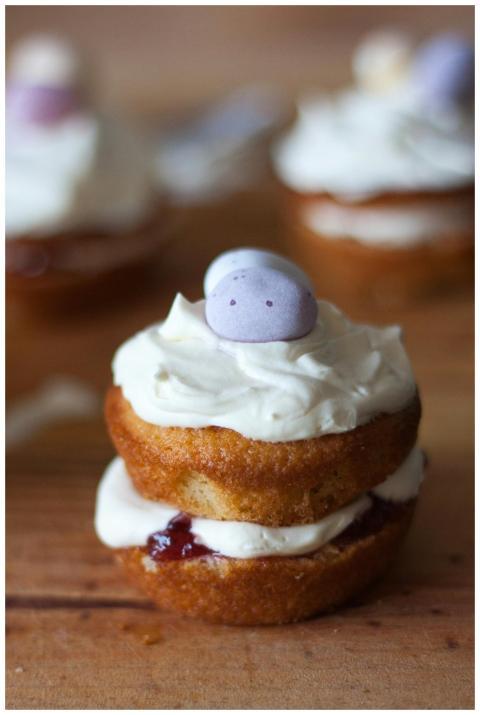 A delightful mini cupcake with cream frosting and