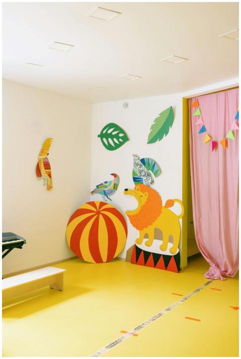 Bright playroom with cardboard animal figures, ide
