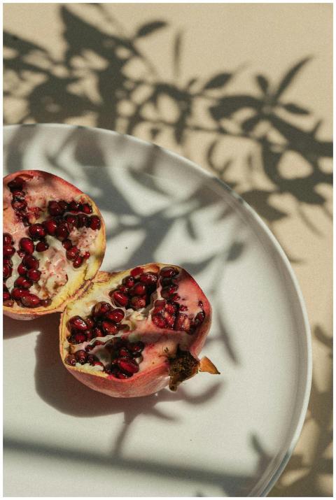 Artistic arrangement of pomegranate halves casting