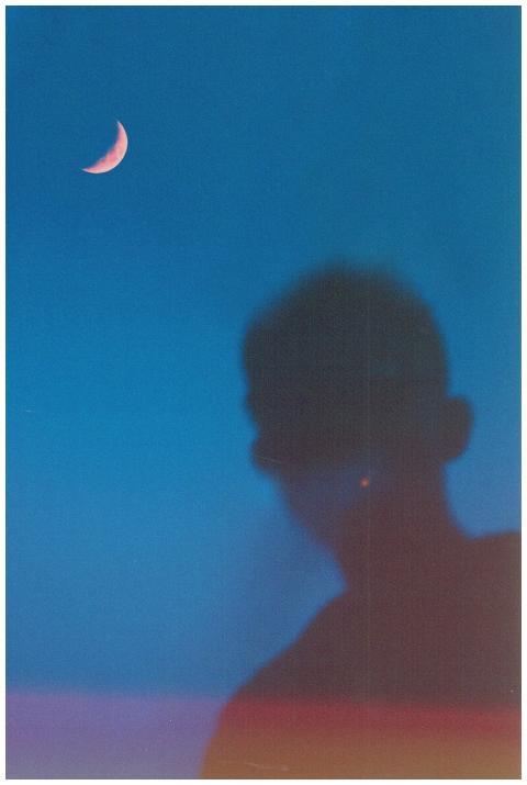 Abstract silhouette with pink crescent moon agains