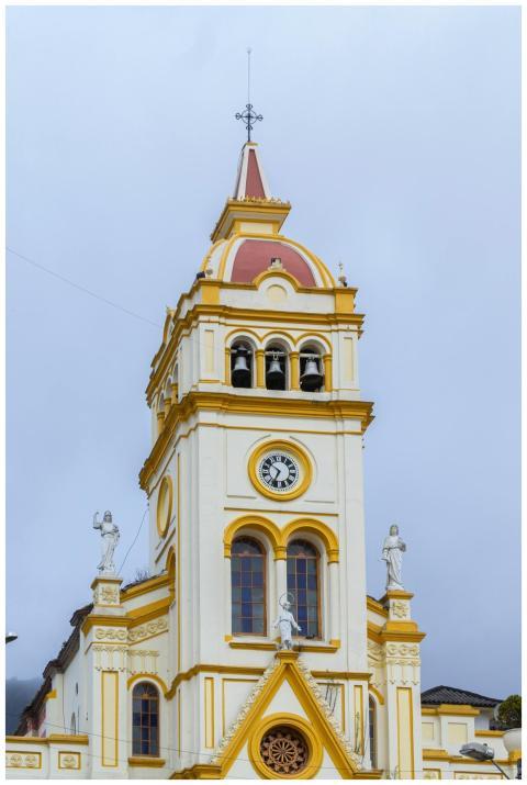 A detailed view of a historic church tower with st