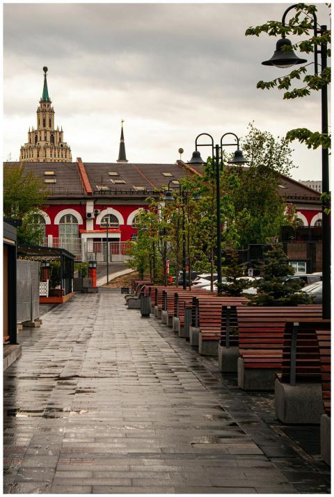 A wet street leads through a historic Moscow marke
