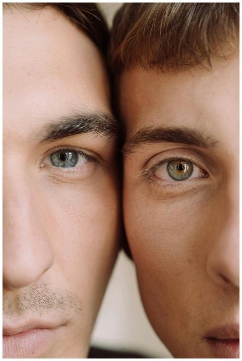 Intimate close-up of two young men showcasing a lo