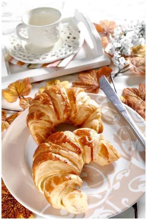 Delicious fresh croissants served with a cup of co