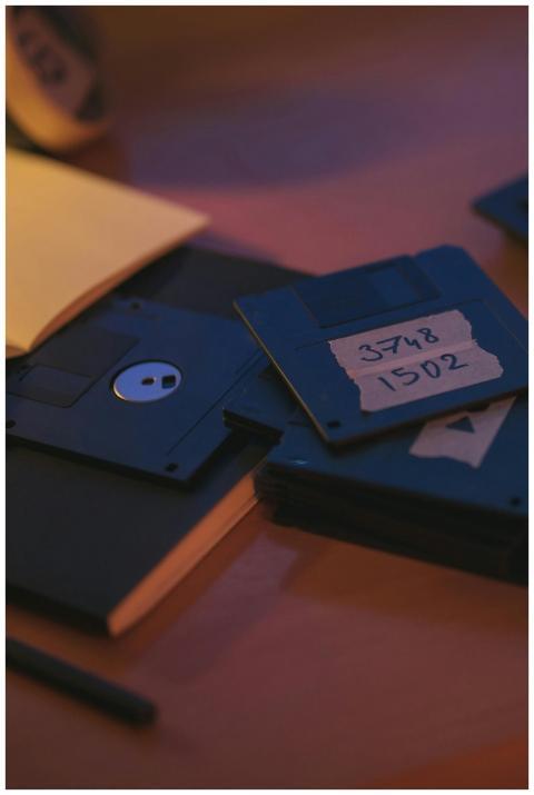 Retro floppy disks on a desk evoke nostalgia and e