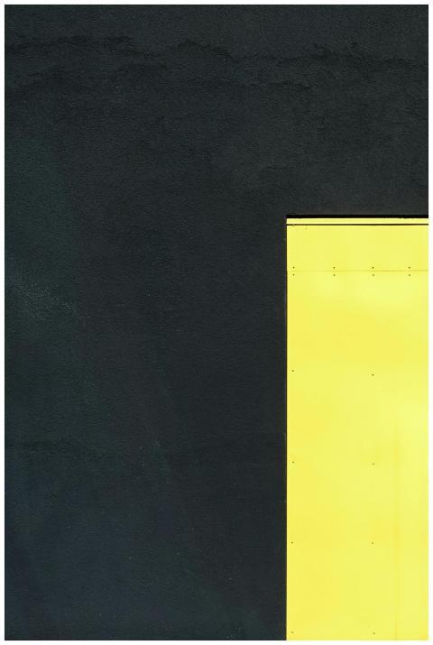 A geometric composition with a bright yellow panel