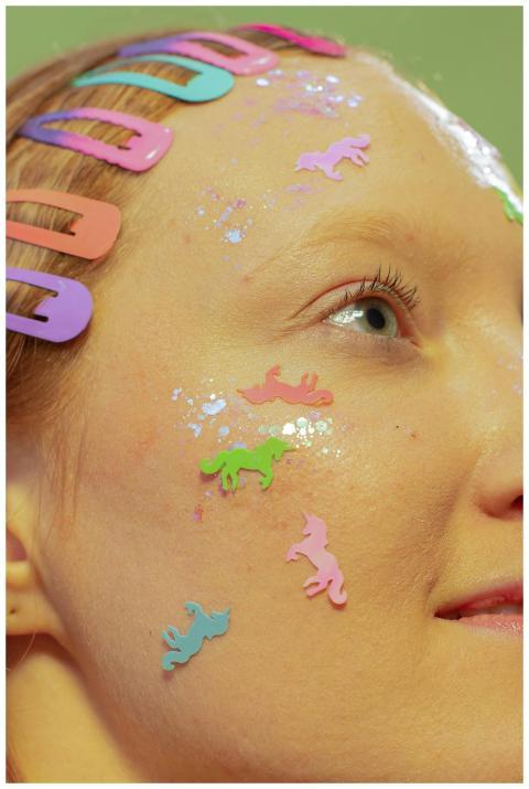 Crop positive female with vivid small stickers on