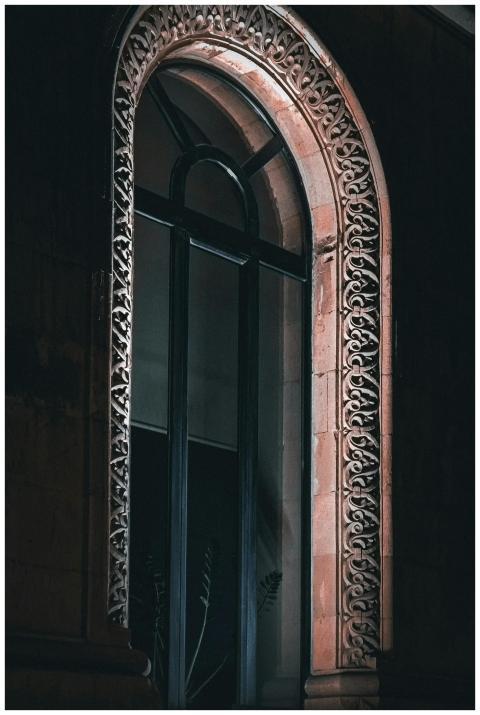 A beautifully lit ornate arched window in Yerevan,