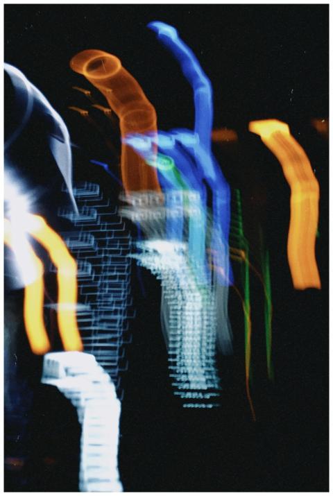Abstract image of vivid neon light trails forming