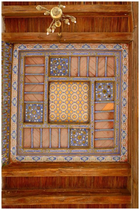 A beautifully detailed wooden and tile ceiling wit