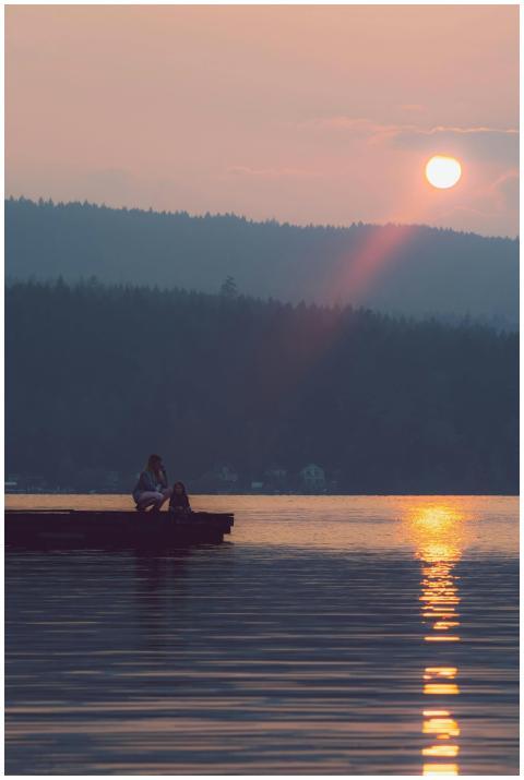 A serene image of a mother and daughter sitting on