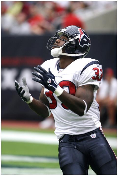 Football player in uniform concentrating during a