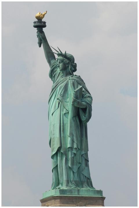 Close-up of the iconic Statue of Liberty under a c