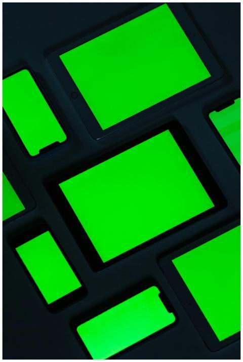 A collection of digital tablets with bright green