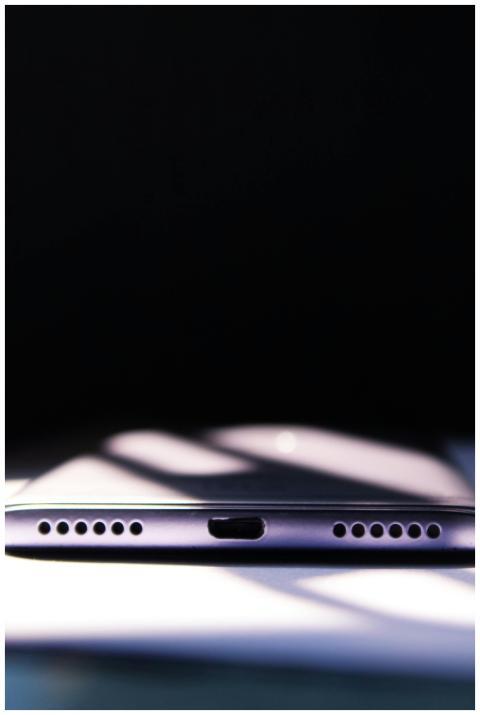 Minimalist close-up of a smartphone's charging por