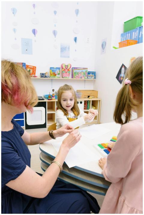 Children creating with modeling clay in a bright c