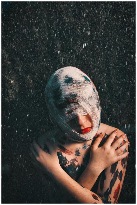 From above of melancholic injured anonymous female