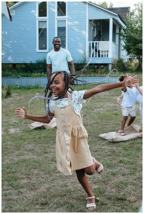 Children enjoy a playful day outdoors in a backyar