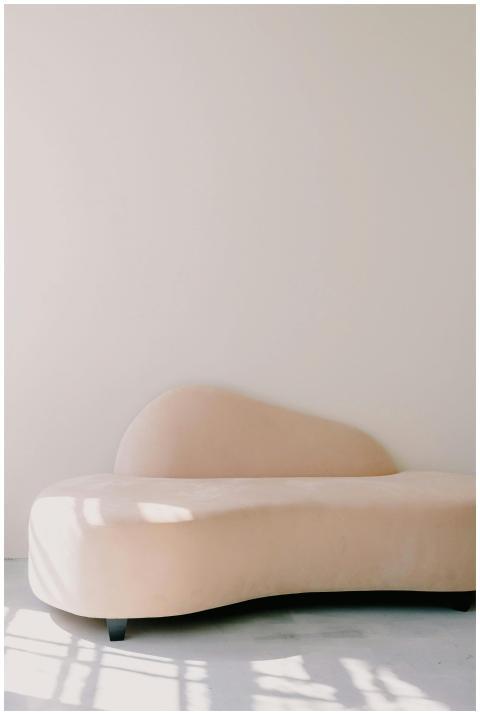 Elegant beige sofa in a minimalist setting with am