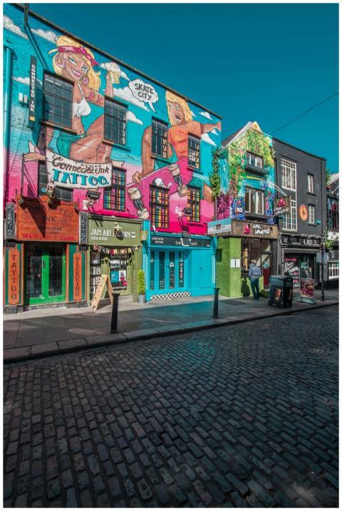 Vibrant street art and shops in a lively Dublin ci