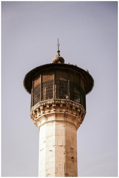 Elegant historic tower featuring ornate ironwork a