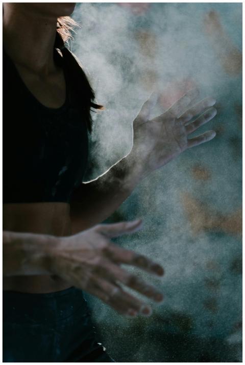 Close-up of a woman athlete's hands covered in cha