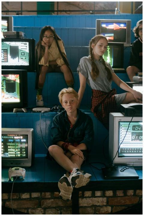 Group of teenagers enjoying classic video games in