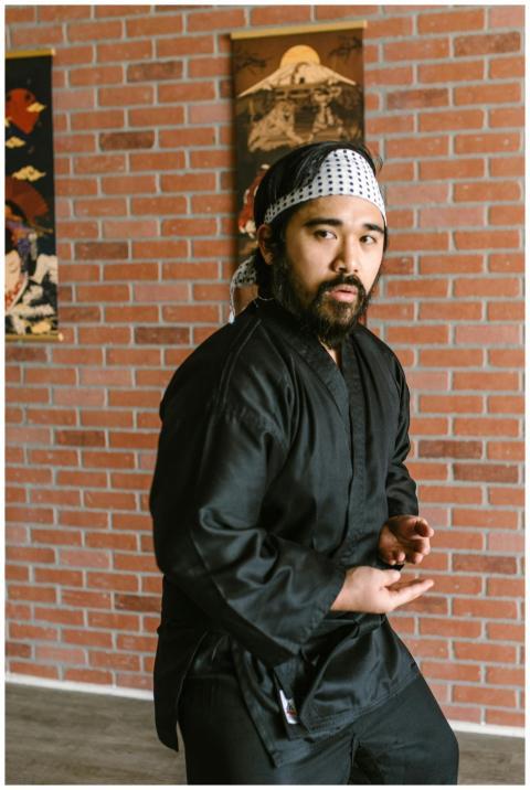 Adult martial artist posing in traditional black a