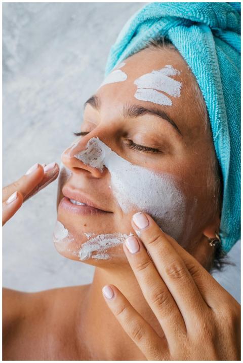 Close-up of a woman with eyes closed enjoying a fa