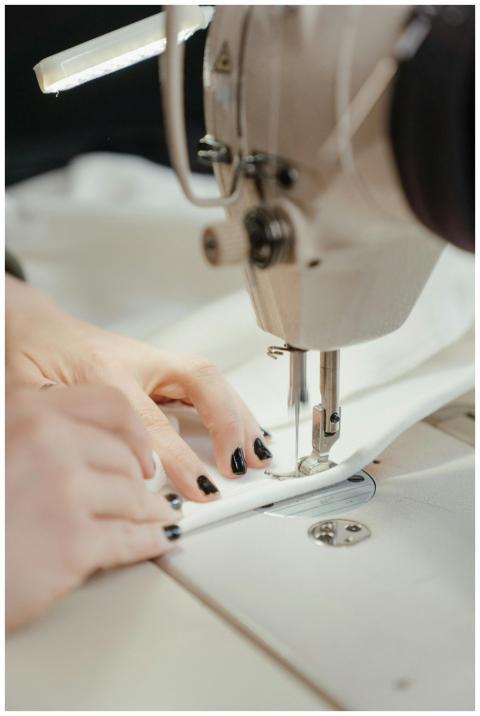 Detailed view of a sewing machine stitching fabric