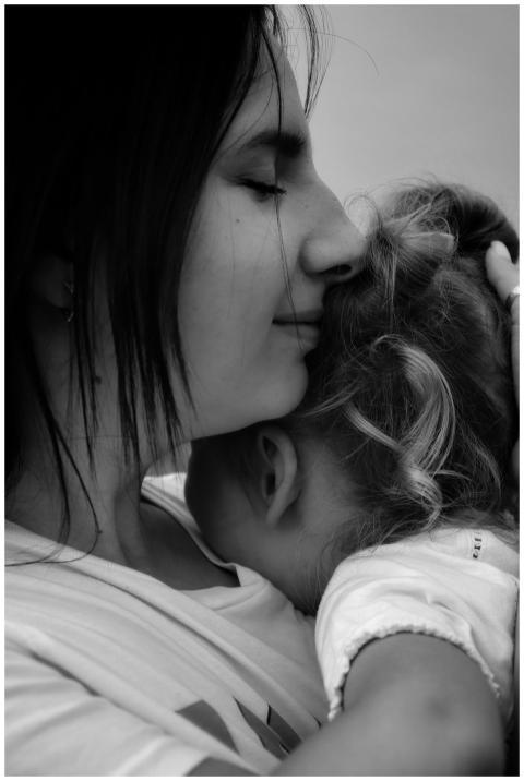 Heartwarming black and white photograph of a mothe