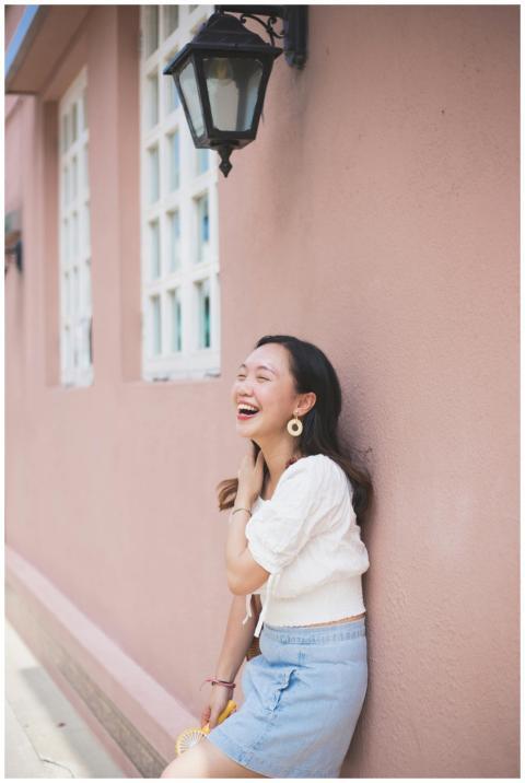 A cheerful woman enjoying a carefree moment outsid