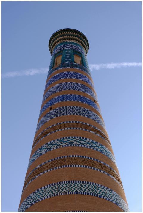 Looking up view of vibrant striped minaret in Khiv