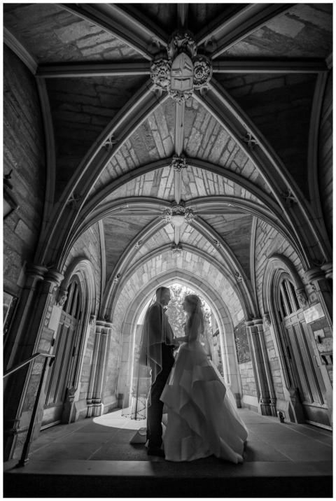 A bride and groom share a moment under a stunning