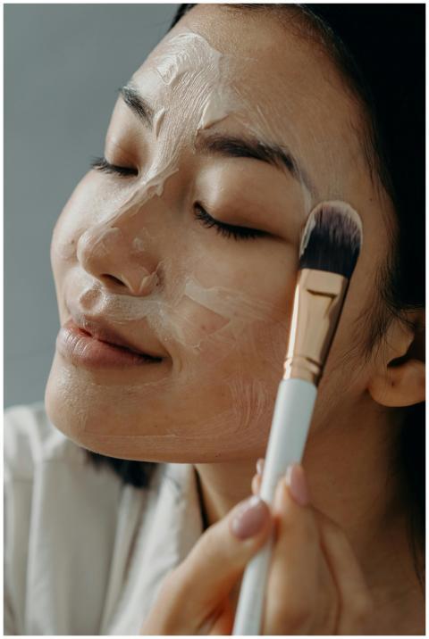 Close-up of an Asian woman enjoying a skincare rou