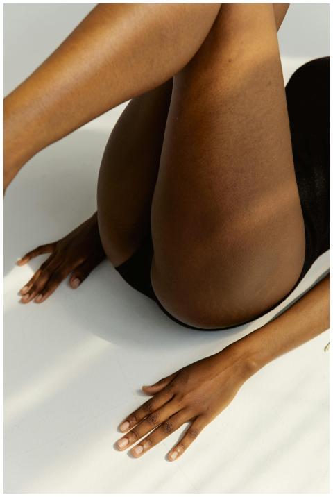 Elegant close-up of a woman stretching, highlighti