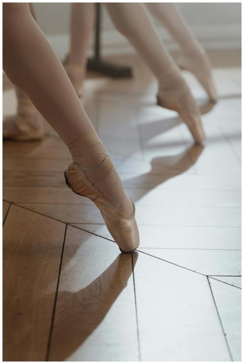 Close-up of ballet dancers practicing on pointe in