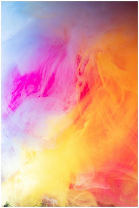 A dynamic blend of bright and colorful smoke in an