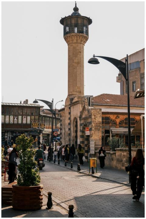 Street view of Aleppo featuring an ancient minaret