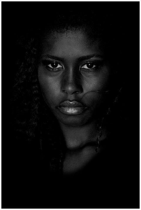 An intense black and white portrait highlighting t