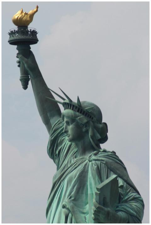 Iconic close-up of the Statue of Liberty against a