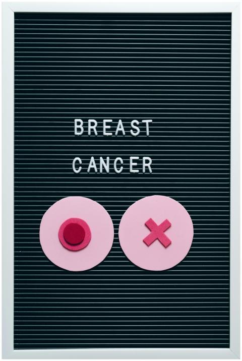 Breast cancer awareness message on letter board wi