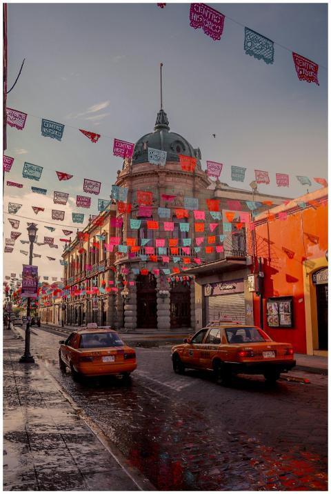 Colorful papel picado decorates the streets of Oax