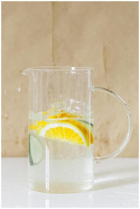 Glass pitcher with refreshing citrus and cucumber