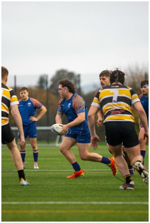 Intense rugby action on a vibrant field with playe
