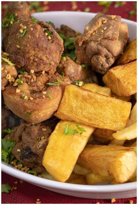 Crispy fried chicken served with golden potato fri
