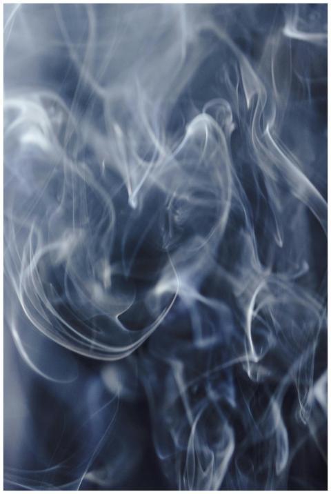 A captivating abstract image of swirling smoke cre