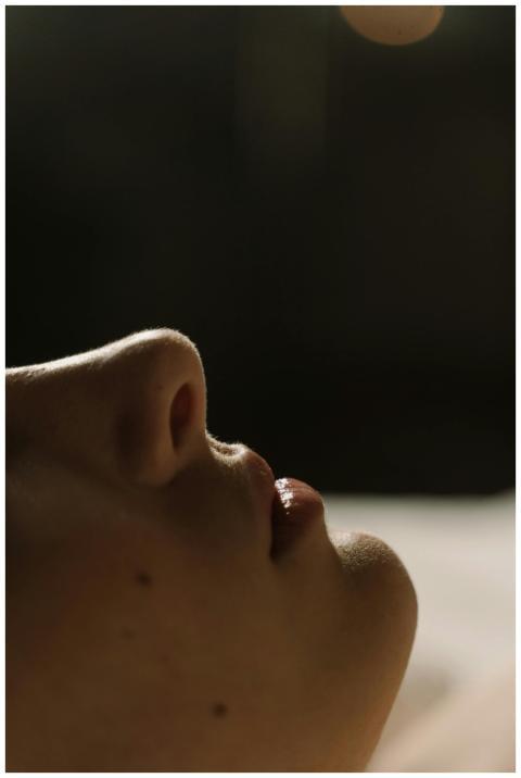 Close-up of a human side profile focusing on the n