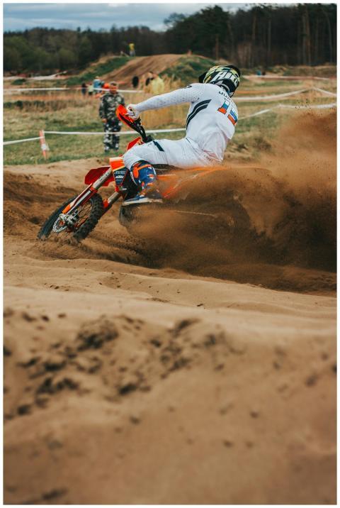 Dynamic motocross racing scene with a biker on a d