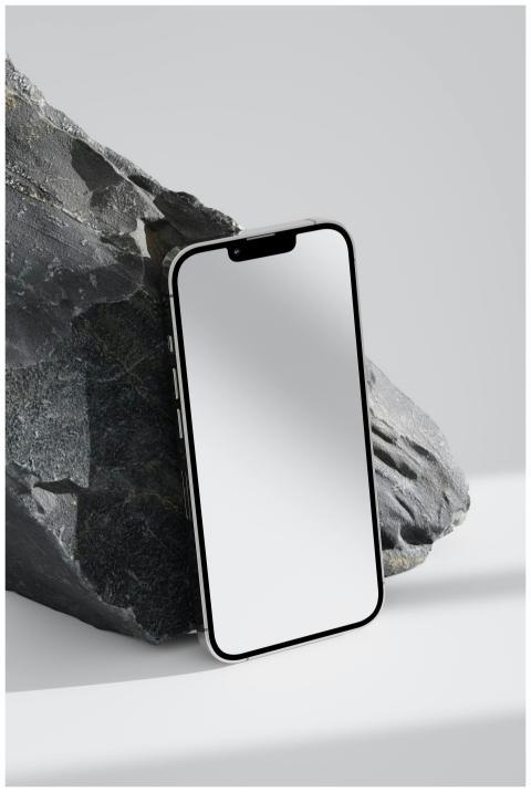 Close-up of a smartphone against a stone backgroun